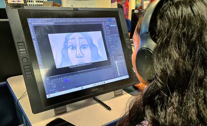 a female students works on a computer
