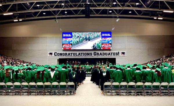 Class of 2023 standing in front of the graduation stage ready to walk in their ceremony