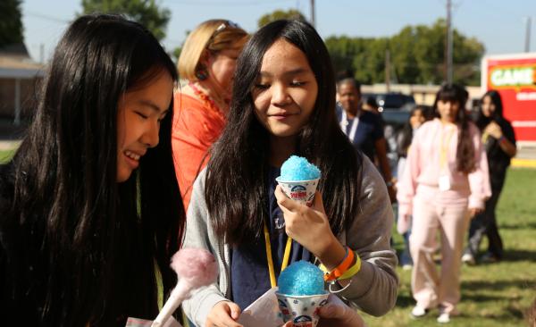Two female students enjoy snow cones