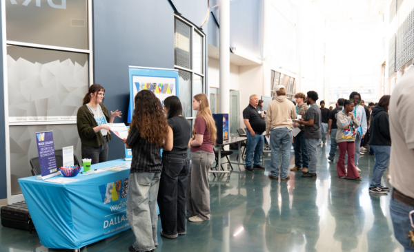 Students speak with prospective employers at a job fair