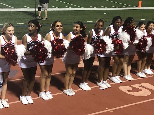 North Garland cheerleaders preparing for a tumbling line