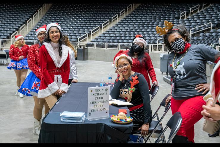 Staff and drill team dressed in holiday hats