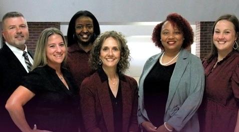 Assistant principals from Rowlett HS smiling together.