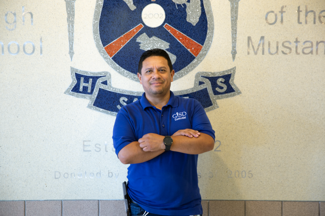 Lio Rodriguez stands with arms crossed