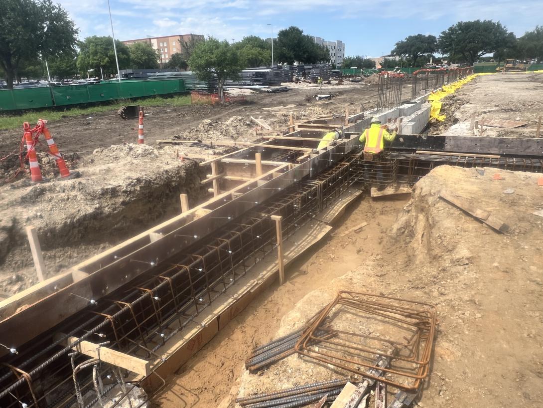 Construction workers working in the ground on a build