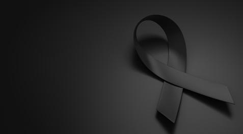 A black ribbon on a black background.