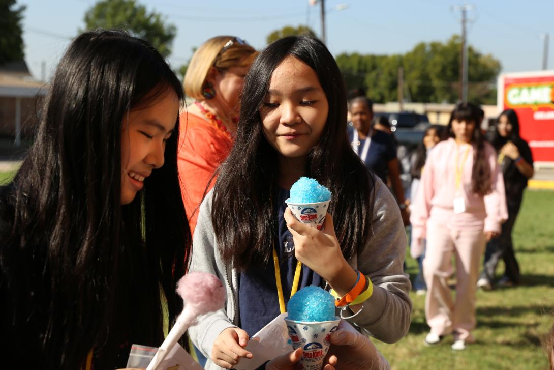 Two female students enjoy snow cones