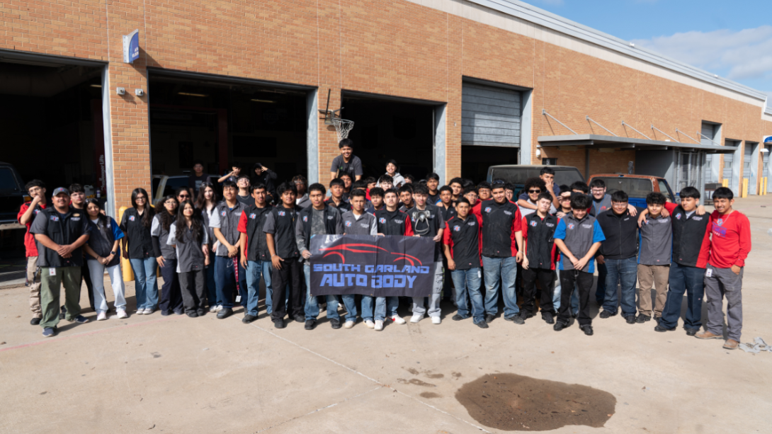 a large group of students stand together