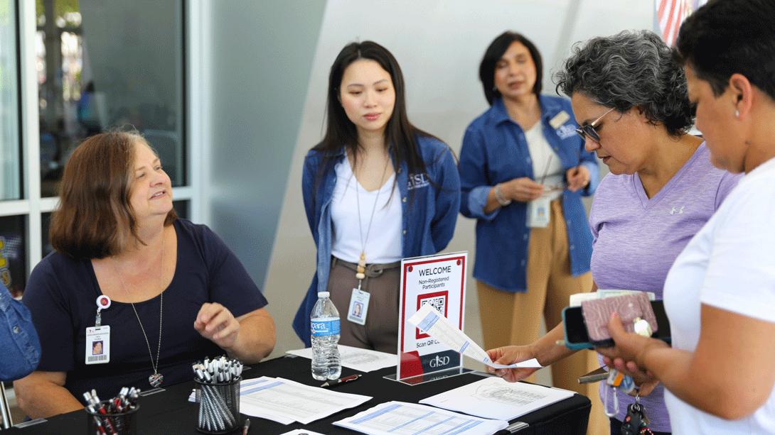 GISD HR staff help candidates register for the Job Fair.