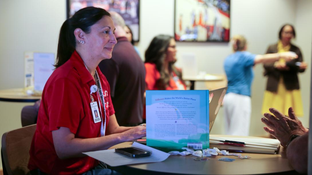 A Special Education staff member smiles while conducting an interview.